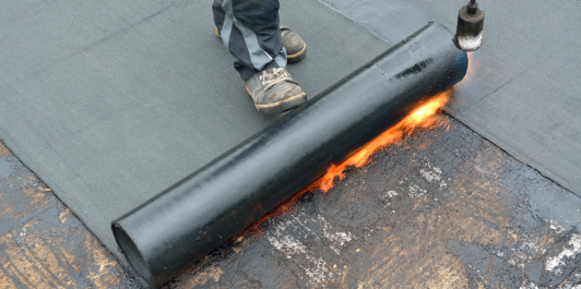 Rolling out self-stick underlayment