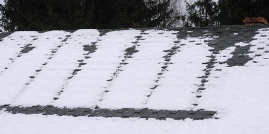 Spots of snow on roof